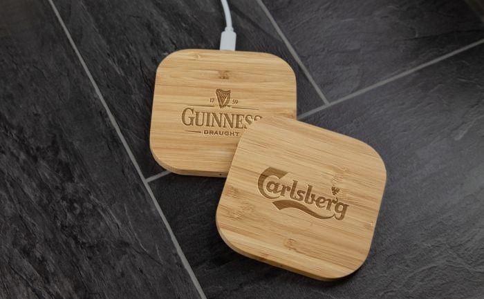 Two bamboo wireless chargers with laser engraved logos