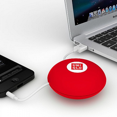 Cable Manager Spinni™ red version with phone and laptop