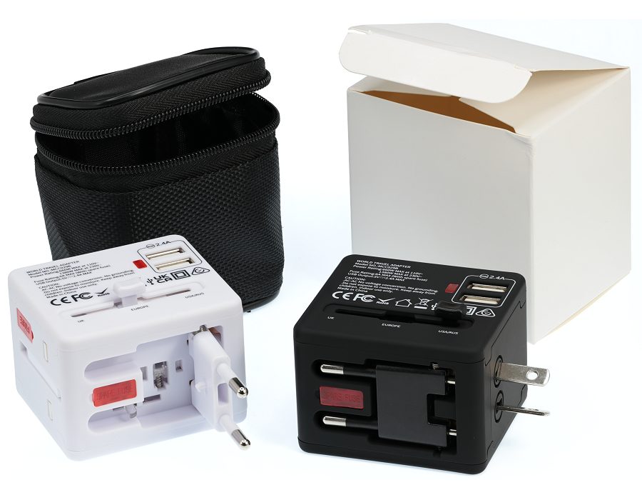 White and black travel adaptors with case and box