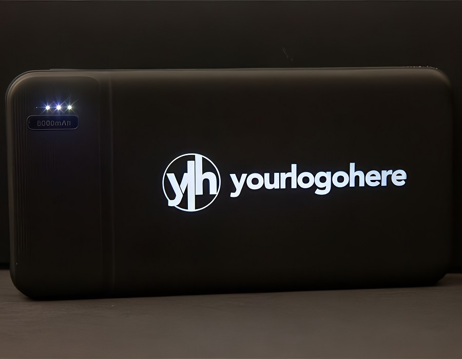 Power Bank in dark setting showing illuminated logo