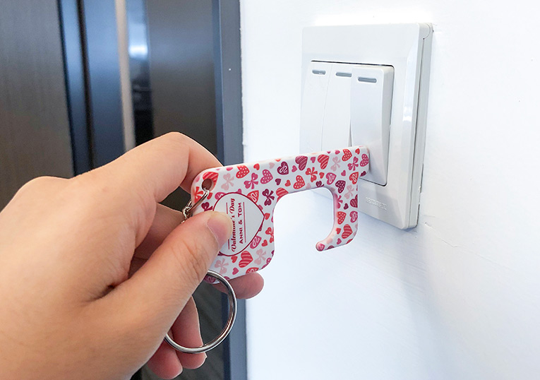 Flicking a light switch with a polymer germ free keyring