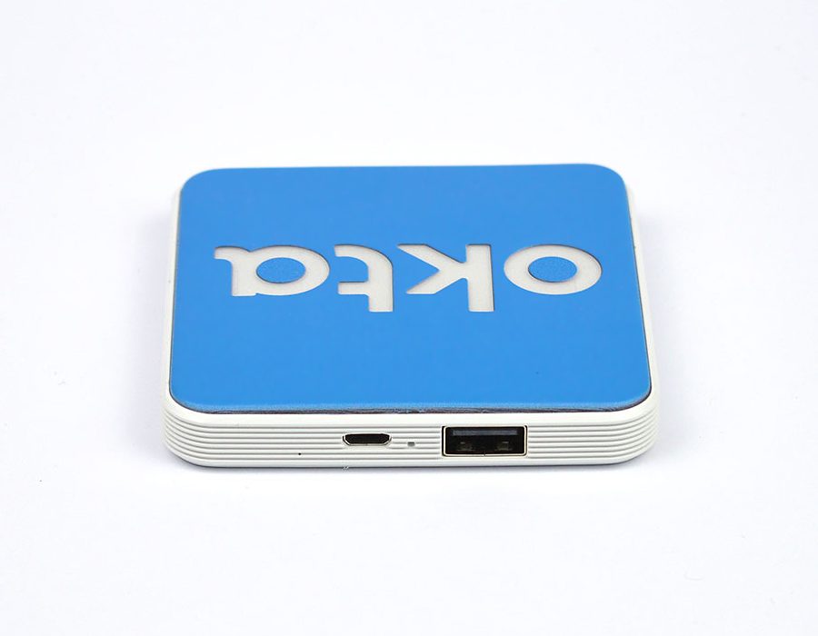 Square wireless charger with white trim and blue and white LED engraved logo